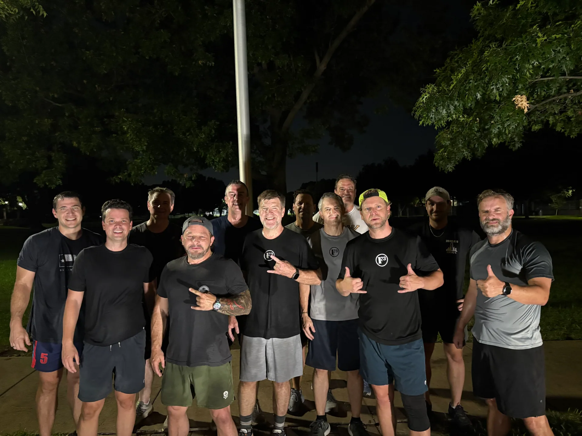 F3 Dallas members together in a park at night